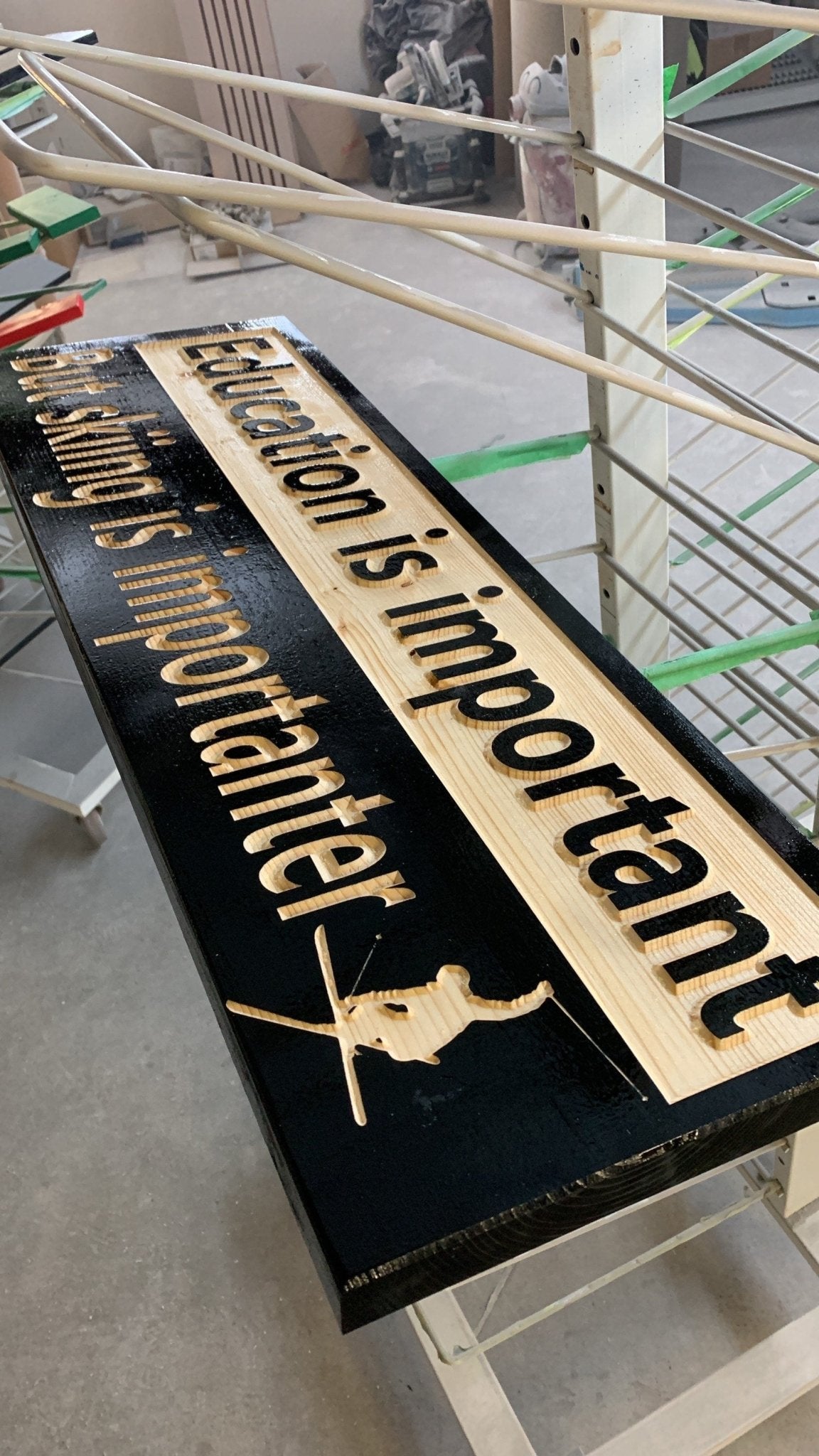 "Education is important but skiing is importanter" sign on solid spruce - Advent Wood Products