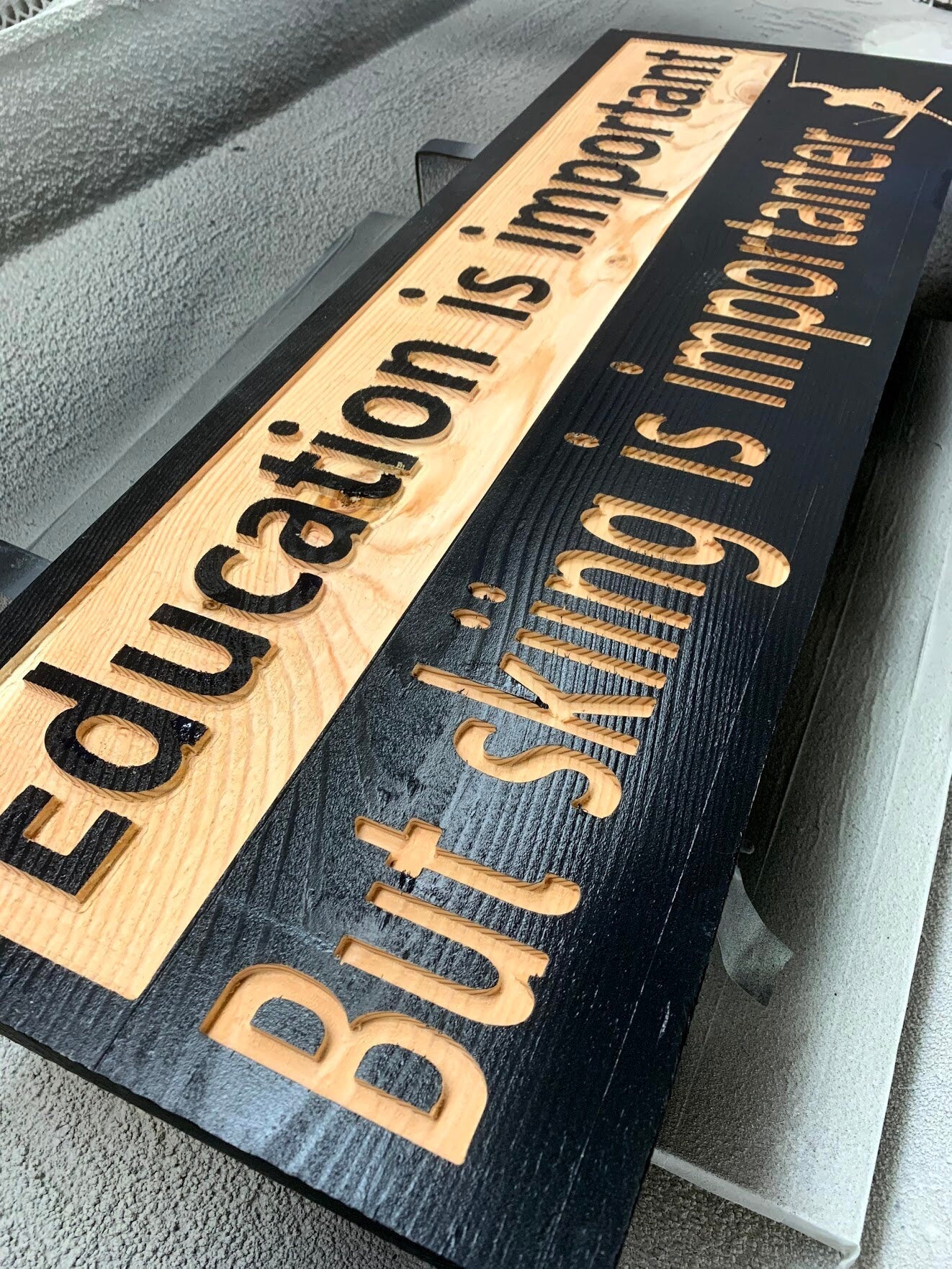 "Education is important but skiing is importanter" sign on solid spruce - Advent Wood Products
