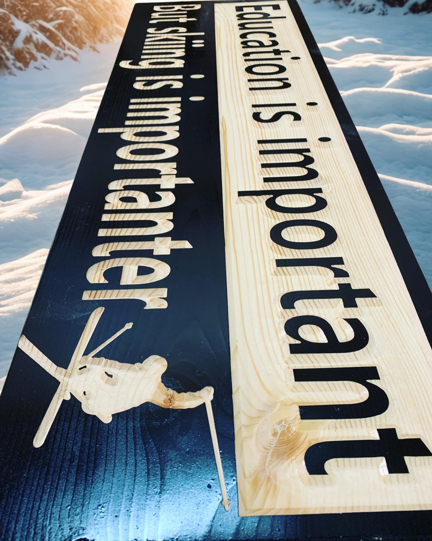 Education is important but skiing is importanter wood carved sign