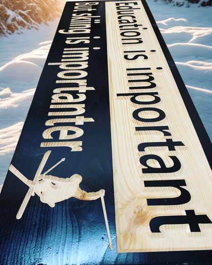 Education is important but skiing is importanter wood carved sign