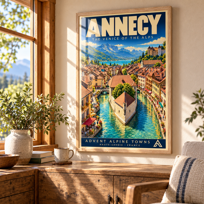 Annecy framed art print in Natural Oak displayed above a timber sideboard beside a summer window, with sunlight and window reflections across the glazing.
