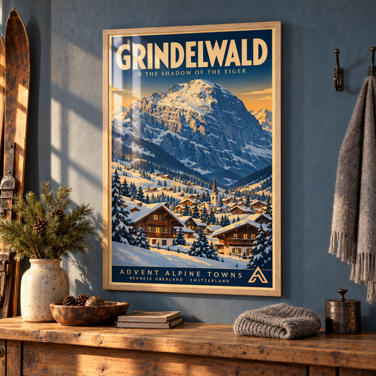Grindelwald framed art print in Natural Oak displayed above a reclaimed-pine console in a mountain-home entrance, with a slate-blue wall, winter accessories and sunlight reflecting across the glazing.