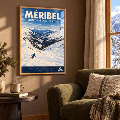 Méribel Mont Vallon art print in Natural Oak beside a moss-green armchair against a warm brown wall, with winter sunlight reflecting across the glazing.