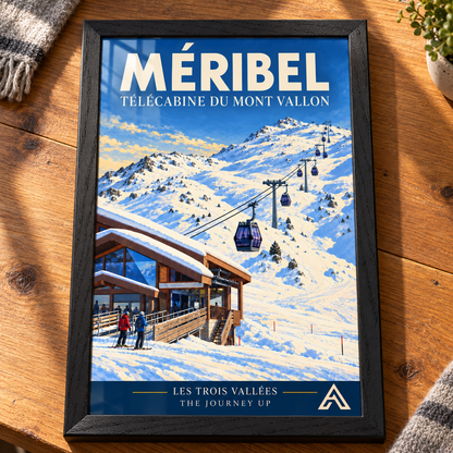 Complete Méribel Télécabine du Mont Vallon art print in Black Ash on a timber tabletop, showing purple gondolas rising from a timber station towards snowy peaks, with sunlight reflecting on the glass.